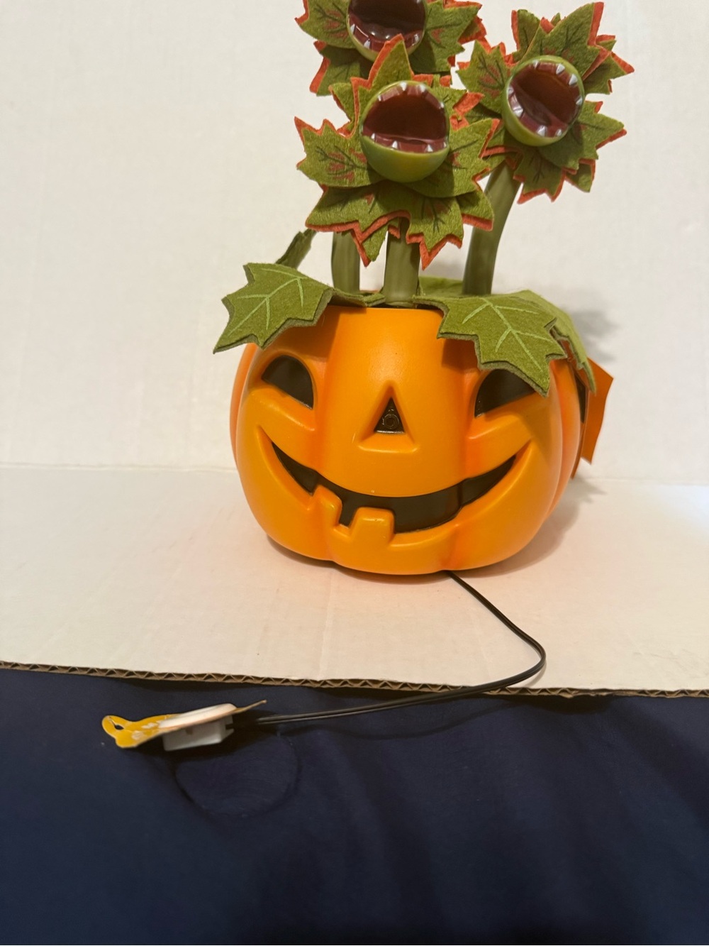 Festive Orange Pumpkin Flower Table Decor with Green Leaves